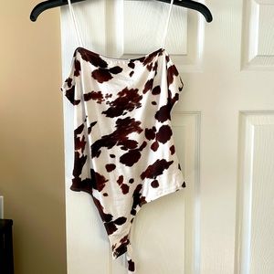 Cow print body suit.